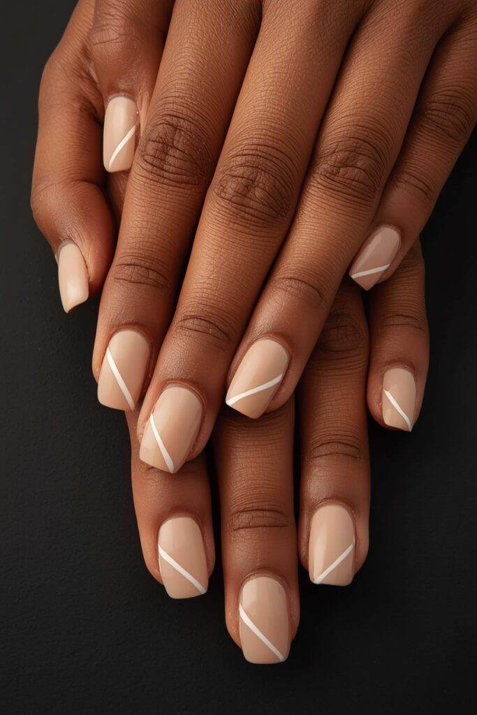 minimal nude nails with white line that make short nails look clean and expensive for nail biters