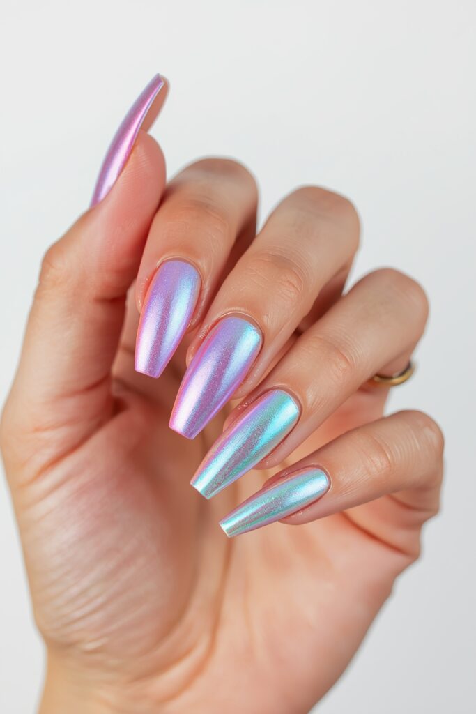 Holographic chrome prom nails with rainbow shift on long oval shape 2026