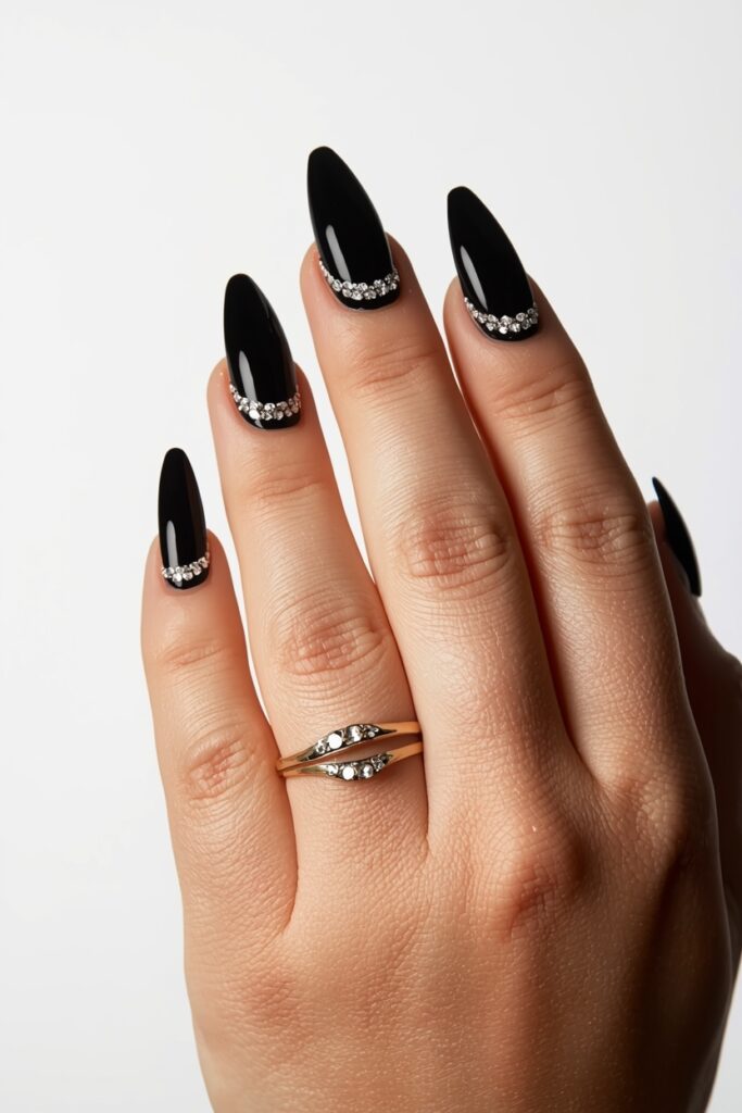 Black French tip prom nails with rhinestone border on stiletto shape 2026