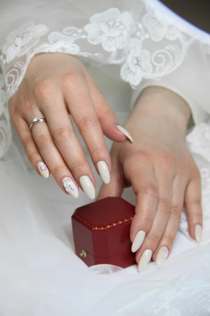 wedding nail ideas 2026 simple cream almond nails elegant understated bride