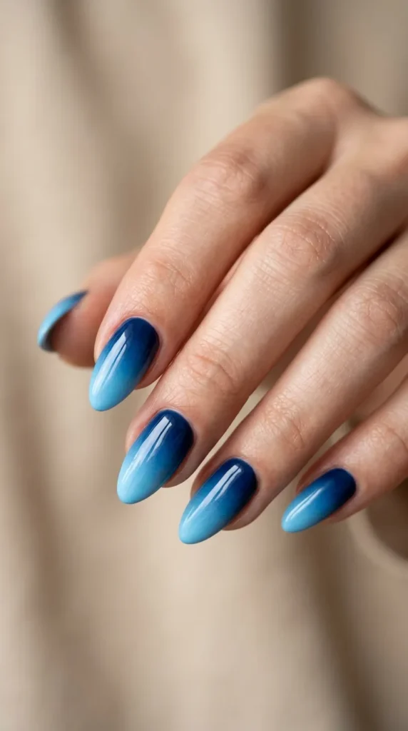 Ocean blue ombre nails on almond shape gradient manicure
