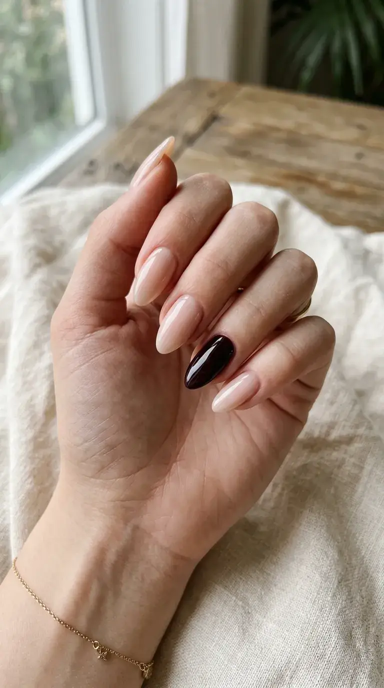 Black cherry accent nail on neutral base