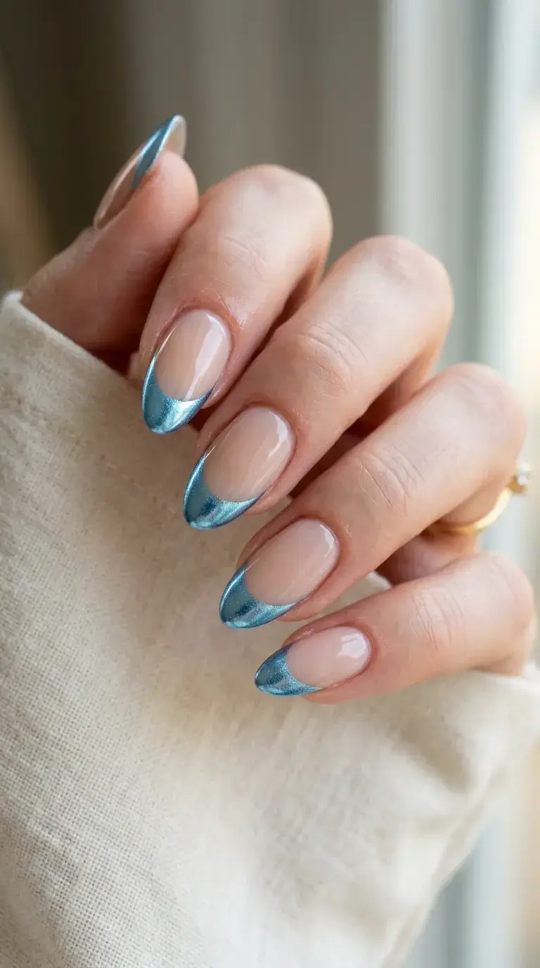Icy blue French tip chrome nails on nude base