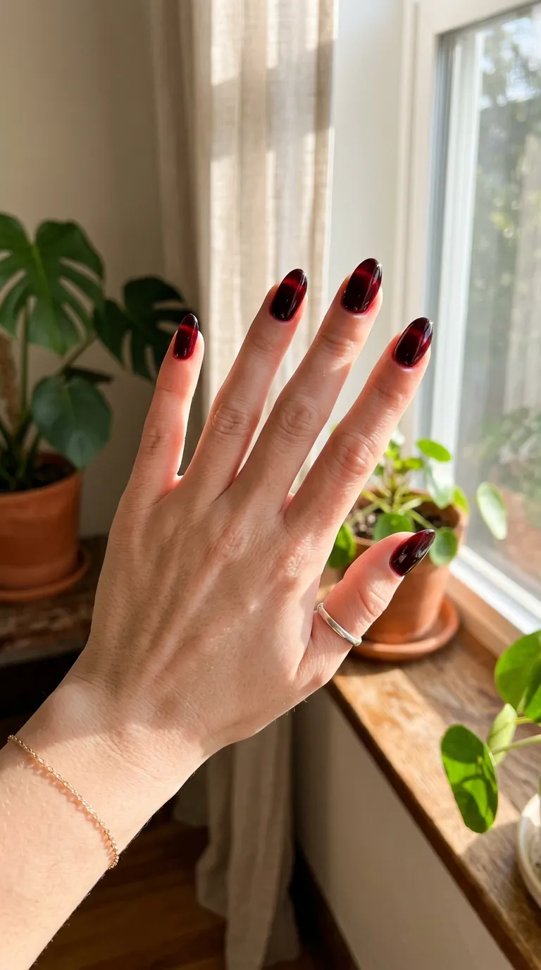 Hand with cherry jelly nails lifestyle shot
