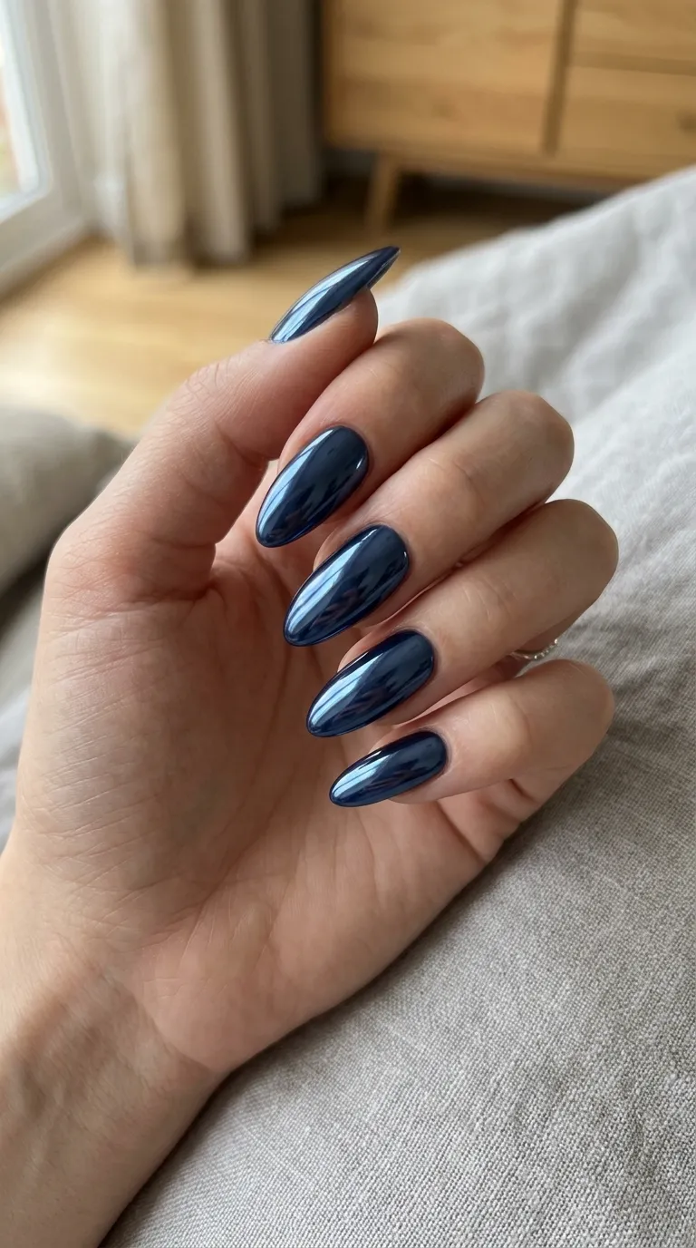 Navy chrome nails styled with wardrobe