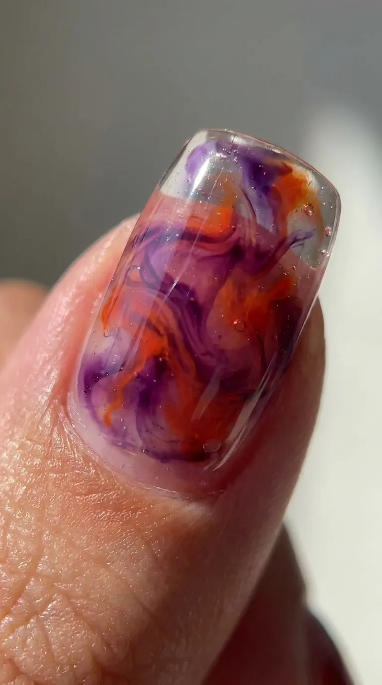 Translucent jelly swirl Tame Impala nail in purple and orange