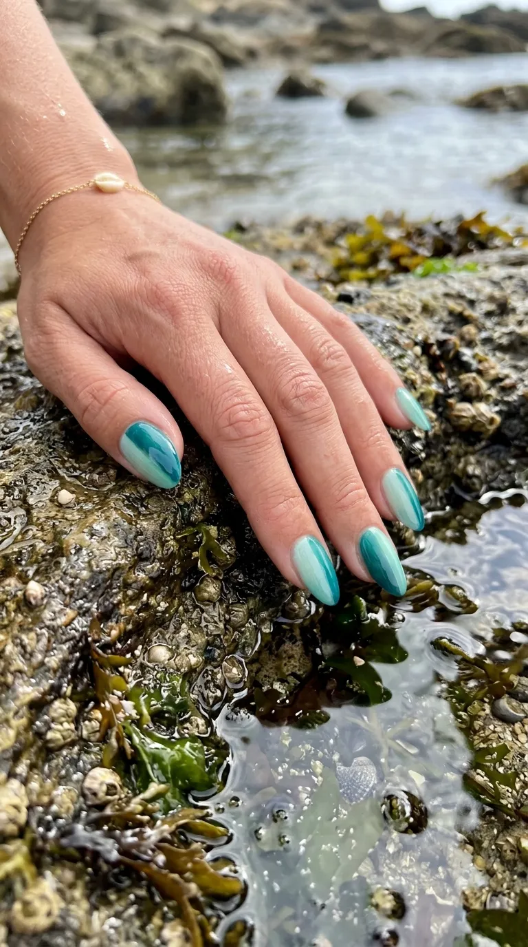 Sea glass ombre surfside nails close-up in seafoam to teal