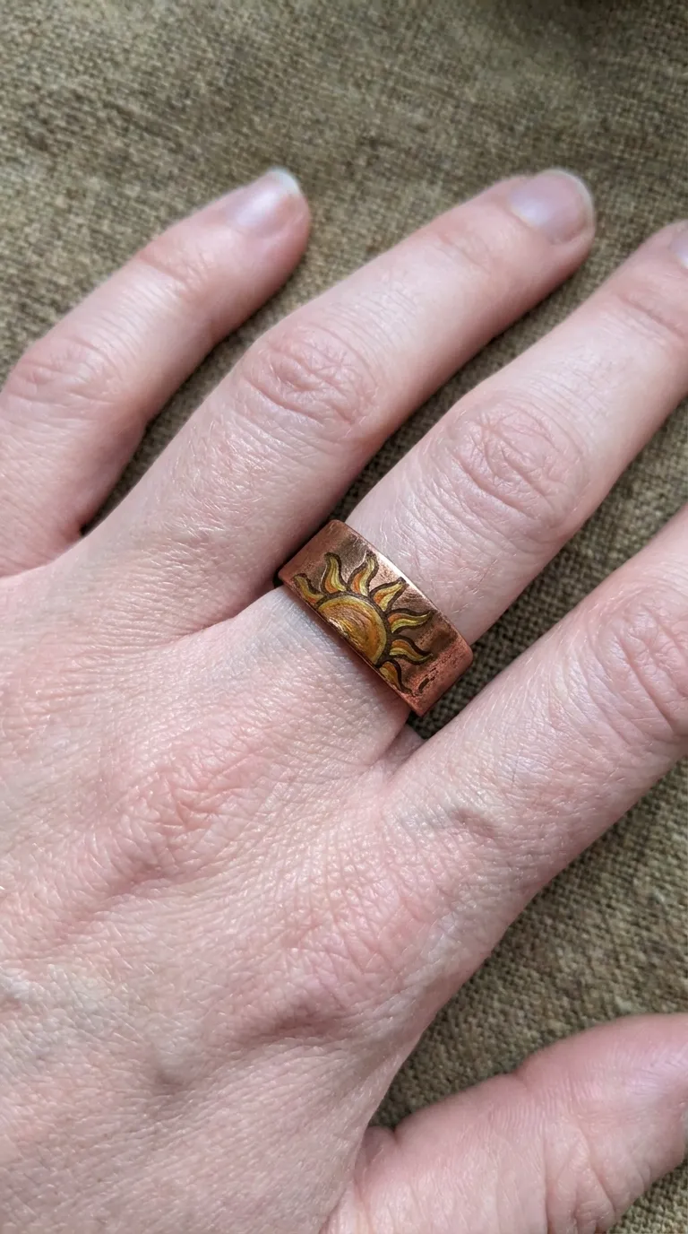 Hand-painted sun motif on a copper base ring finger