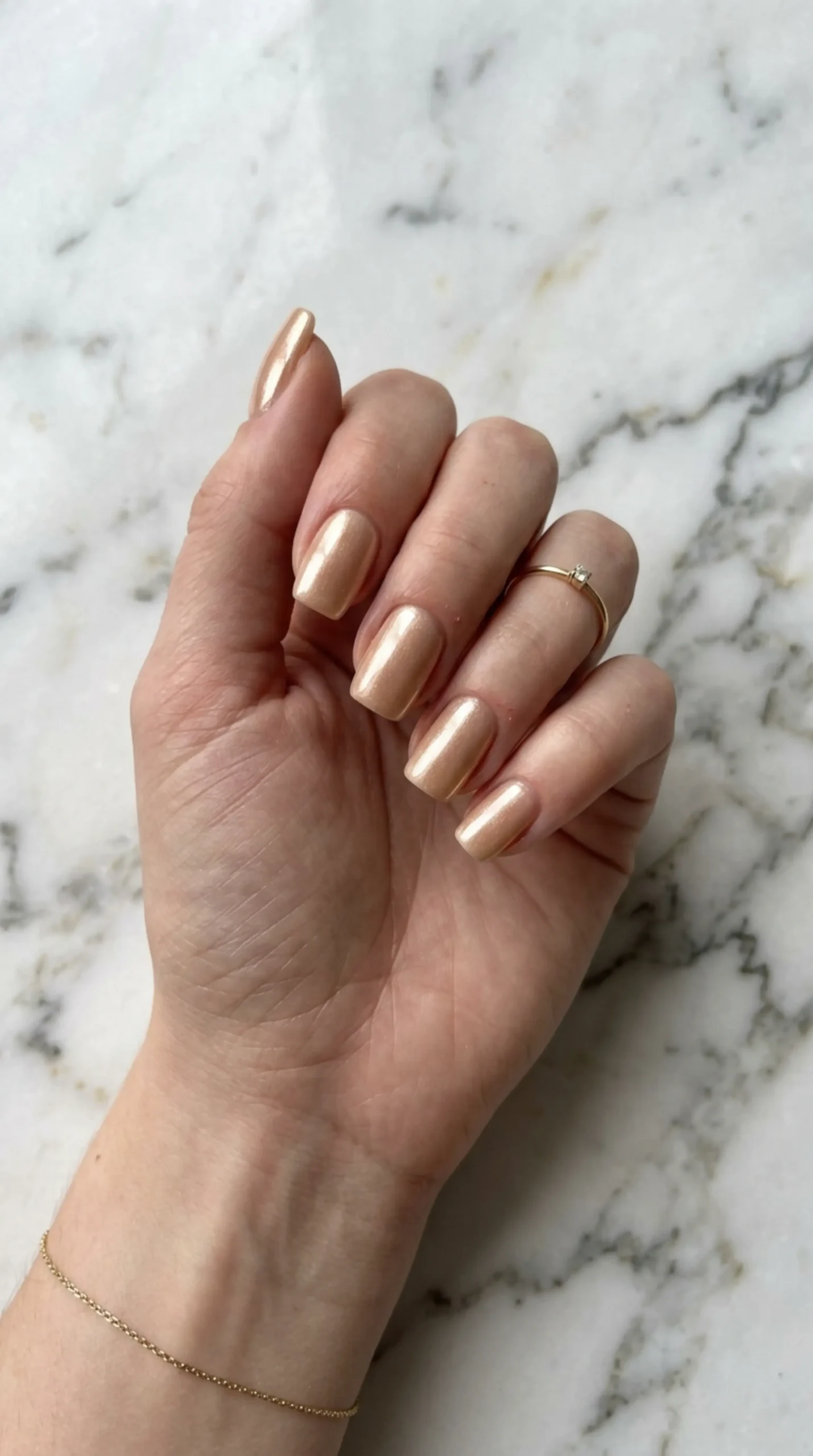 Hand with champagne toned nails