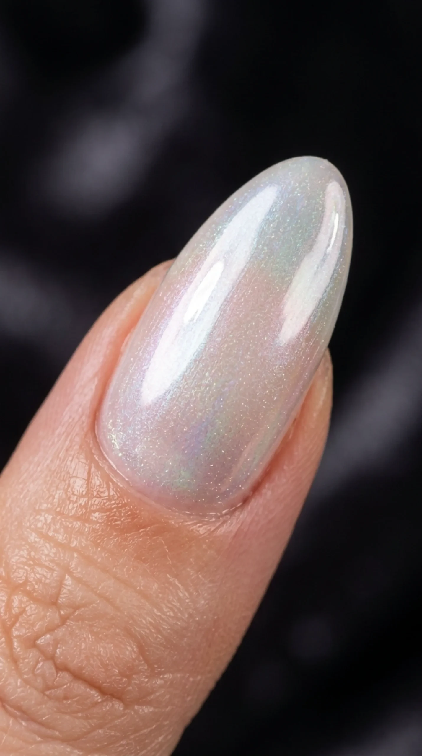 Macro of a nail with pearl finish topcoat