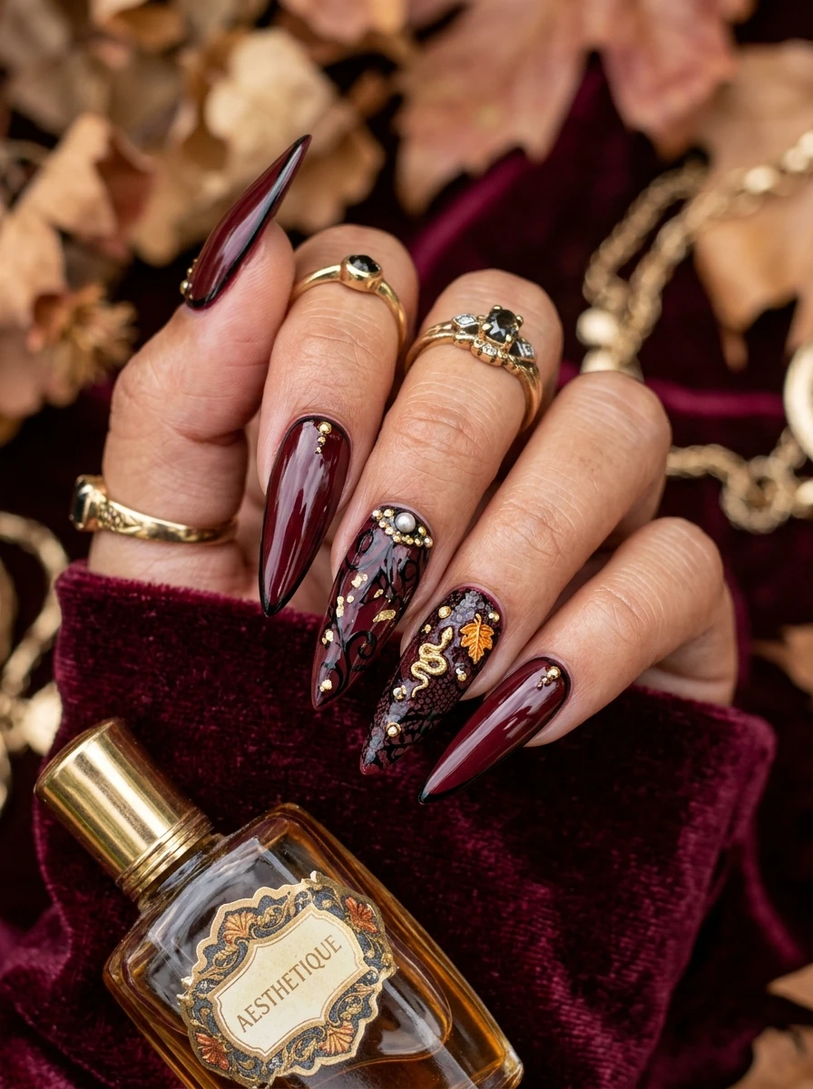 Wine red high-gloss nails with a gold chain charm