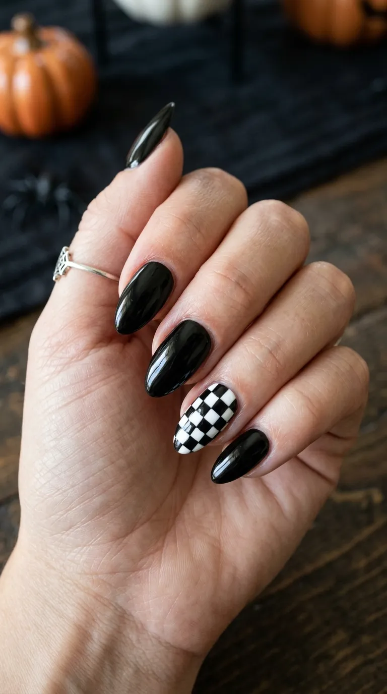 Simple Halloween Nails &ndash; black nails with a checkerboard pattern accent nail