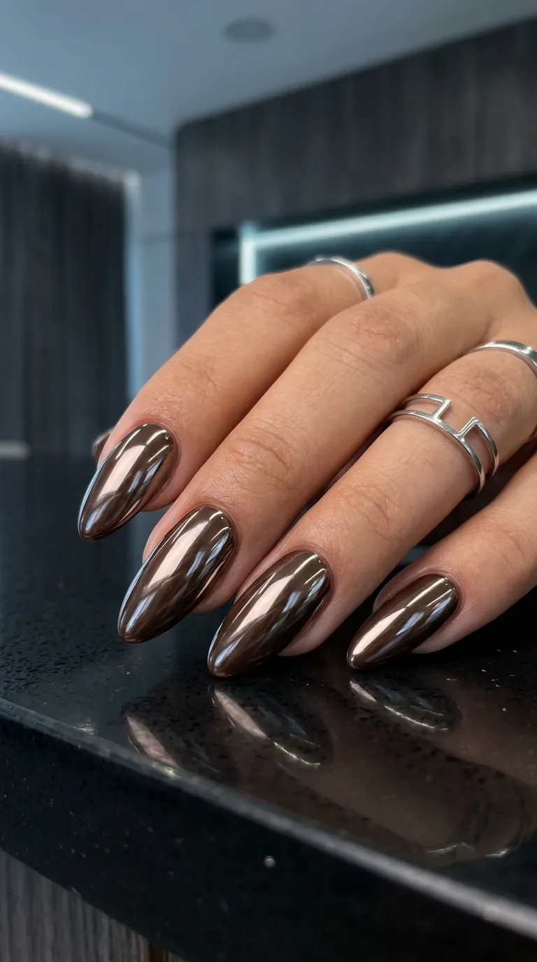 Chrome mocha nails reflecting light