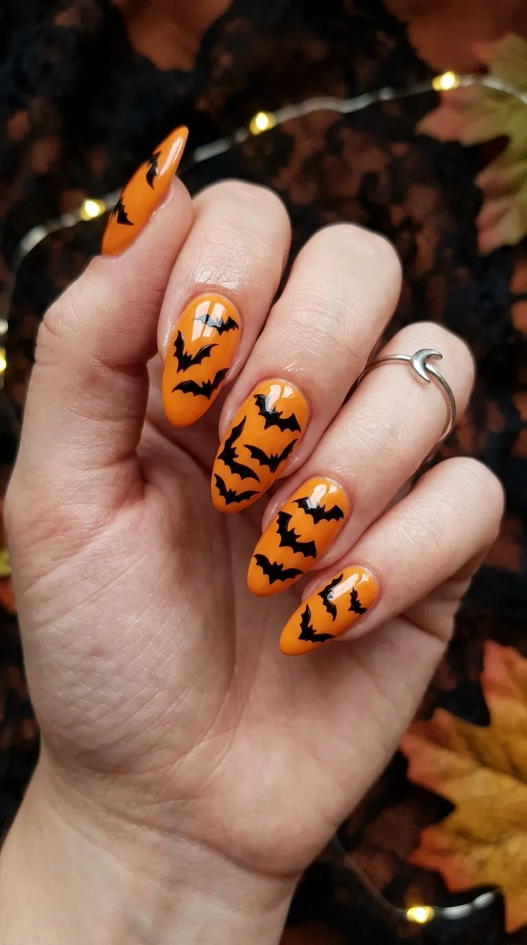 black and orange bats-in-flight bat nails design
