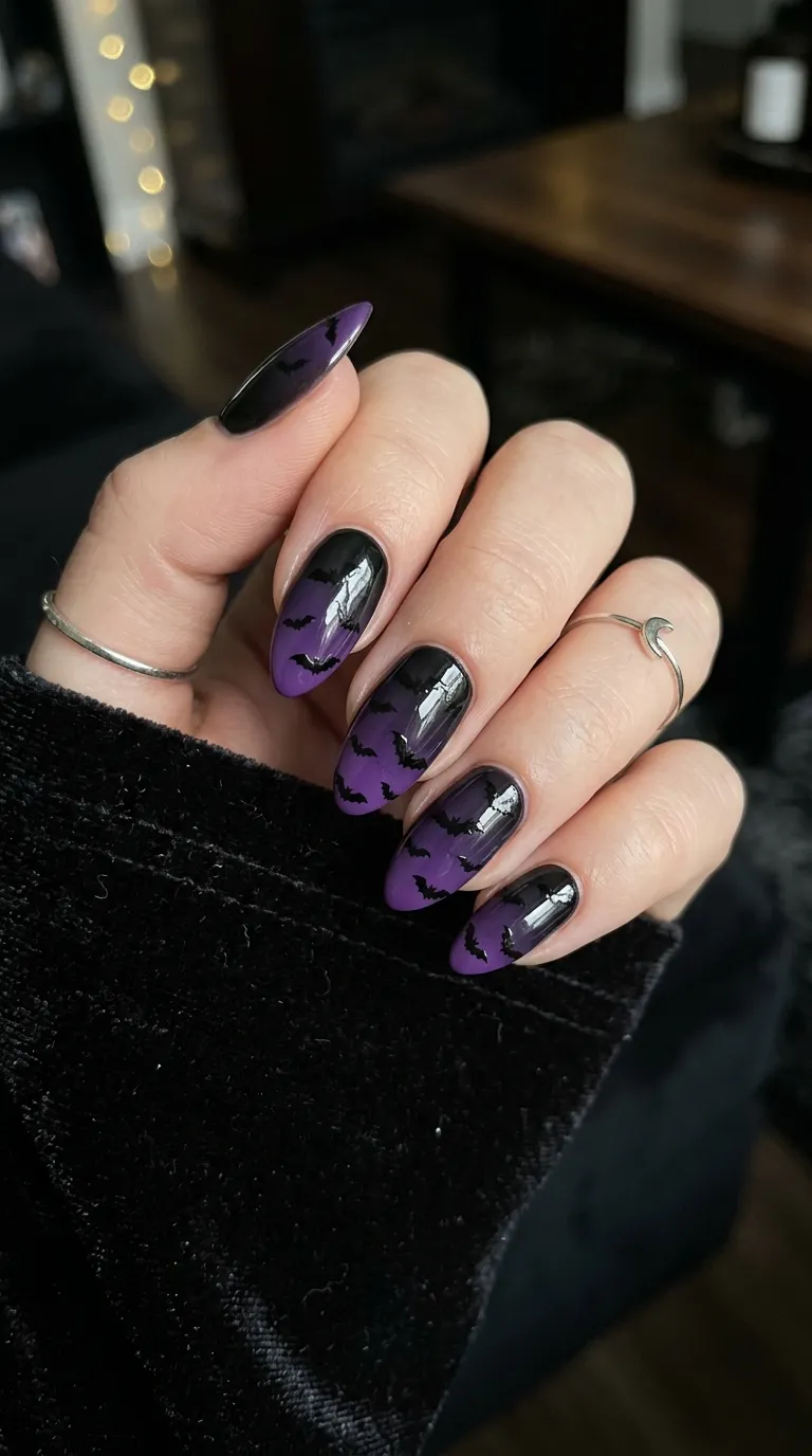 purple to black ombre bat nails with scattered bat silhouettes