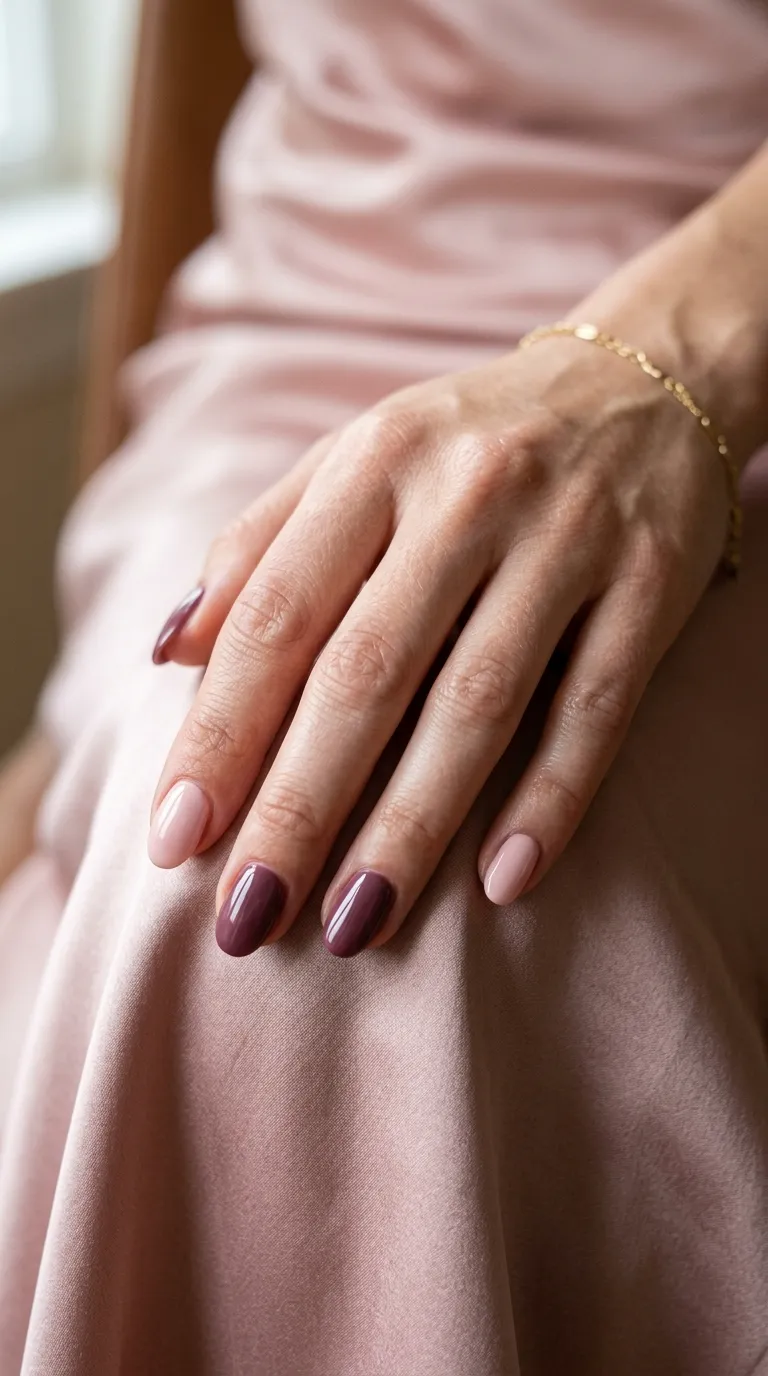 Fall wedding guest nails in soft blush and mauve