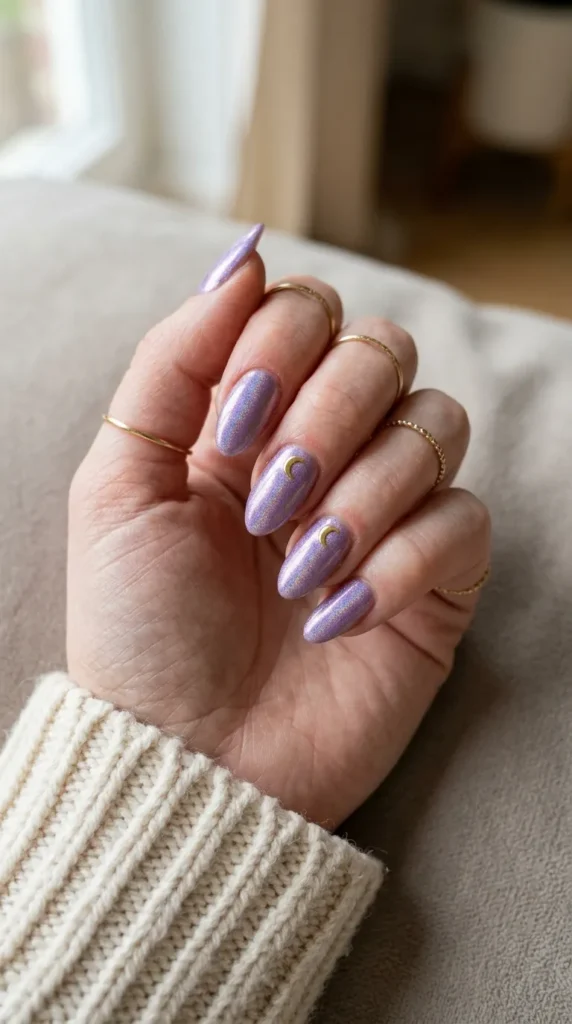 Holographic purple almond nails with small gold crescent moons