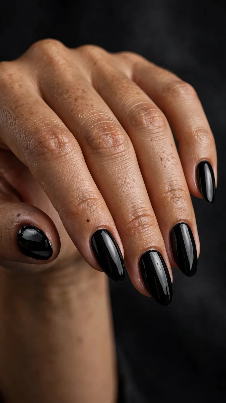 High-gloss black almond nails