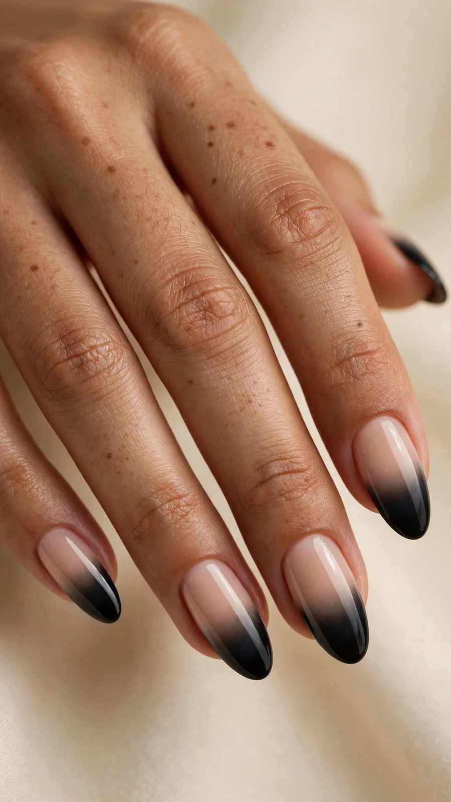 Black ombre nails fading to nude