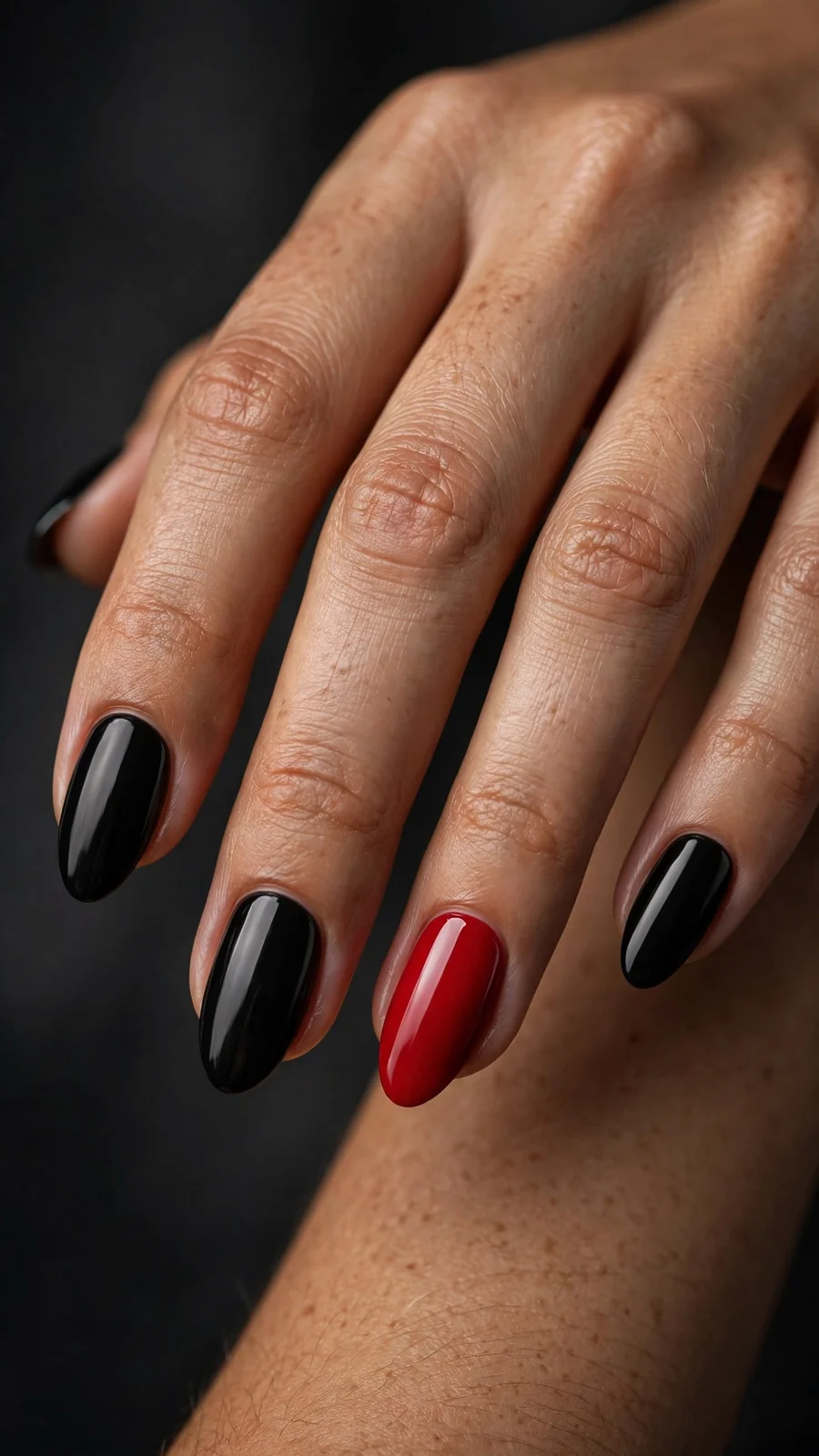 Black nails with red accent nail