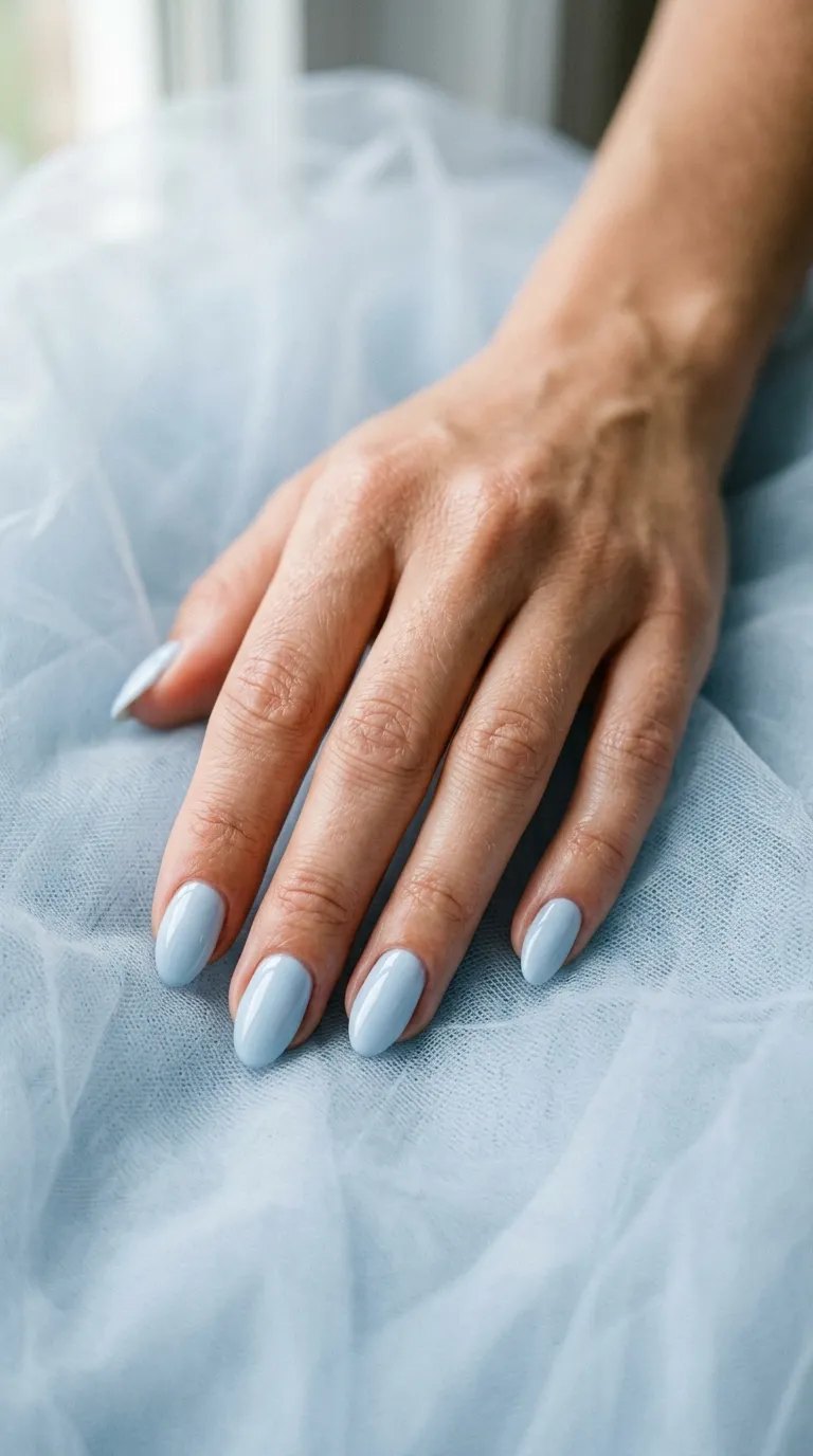 Milky baby blue nails on pale blue tulle