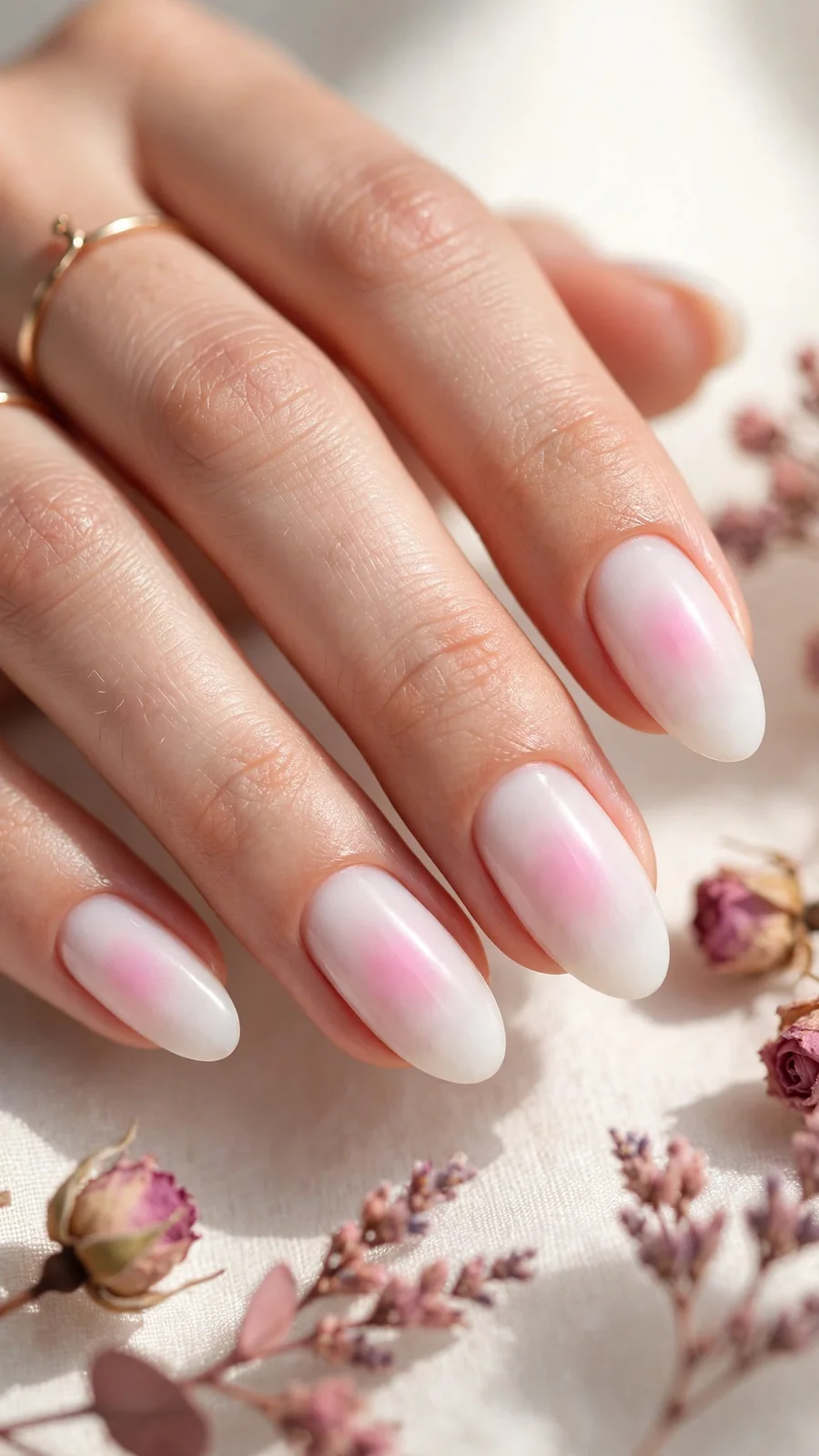 Milky white aura nails with soft pink center glow