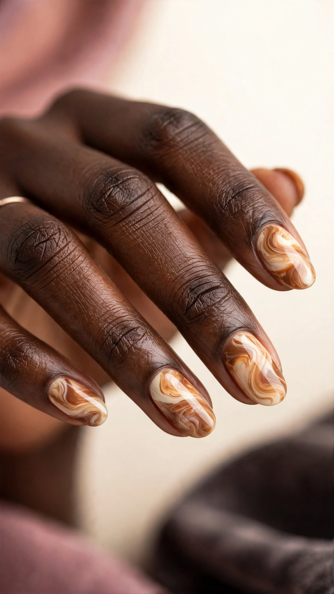 Caramel and cream toffee swirl marble nails, on dark skin hands
