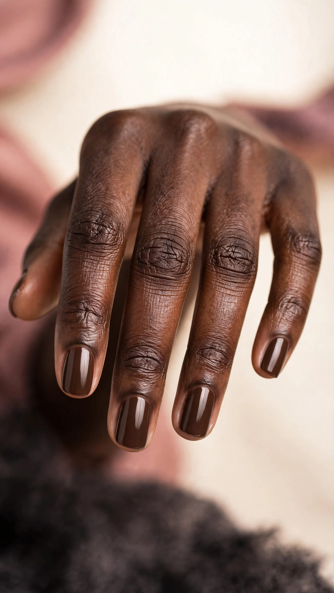 Chestnut brown nails with fine golden shimmer, on dark skin hands