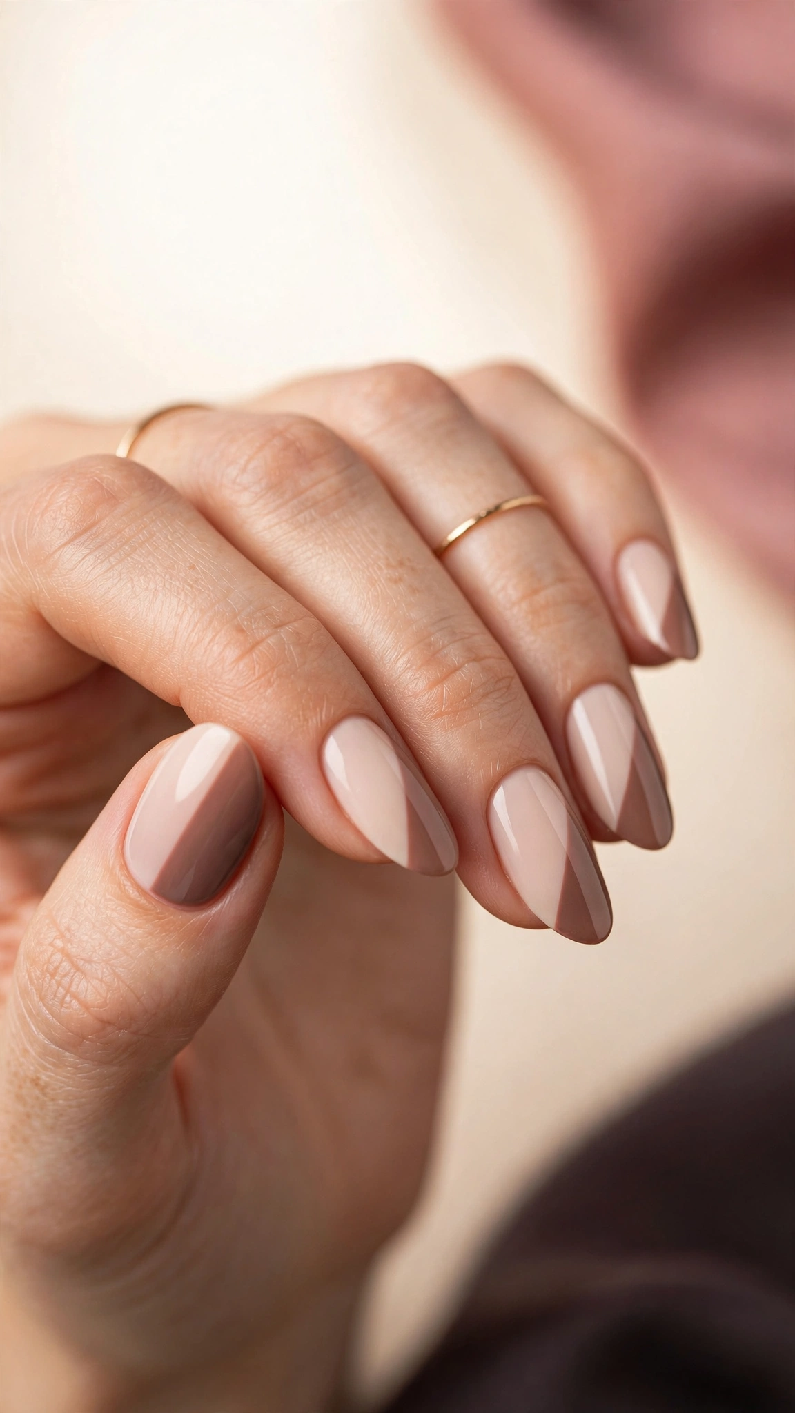 Two-tone nude nails with light and dark nude shades in a color block design