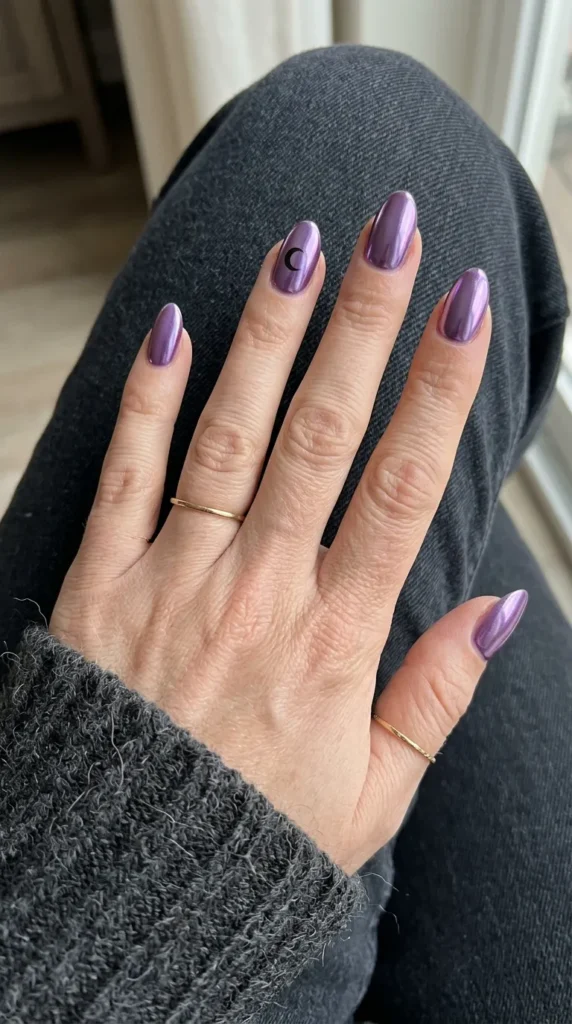 Violet chrome mirror nails with one black crescent moon
