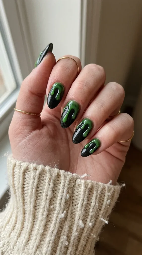 Black nails with raised glossy green 3D slime drips